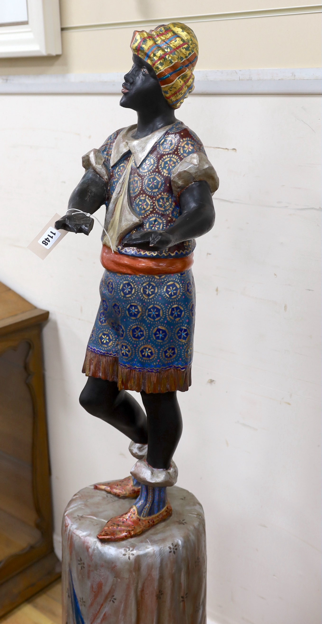 A painted composition Blackamoor waiter, lacking tray, height 142cm